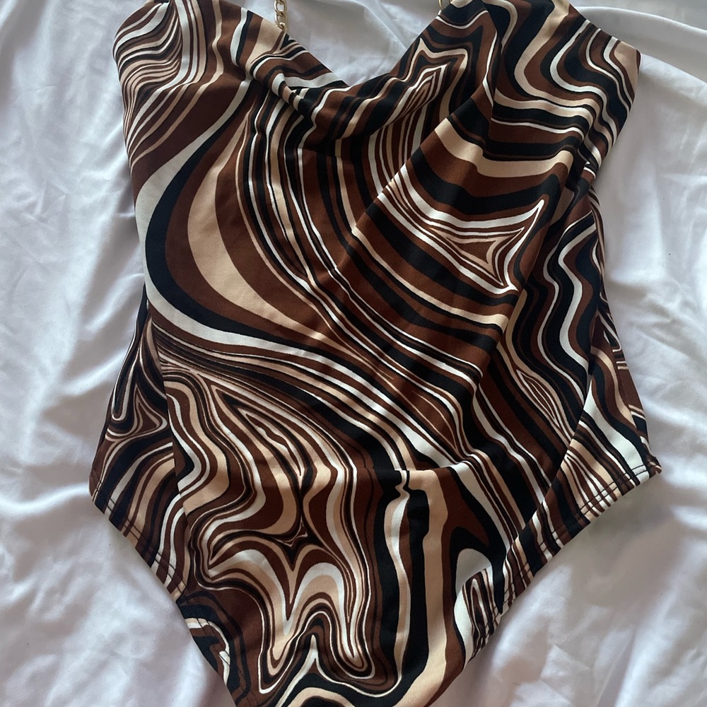 Brown swirl body suit with gold straps